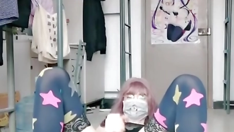 Asian teen is playing with her fingers in the room