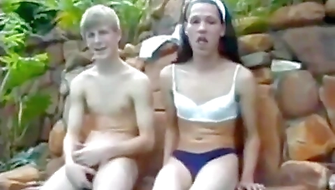 Sexy brunette with a pair of small tits and a pair of earrings