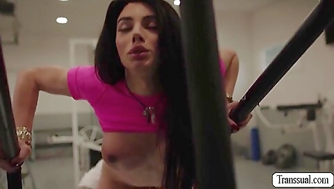 Brunette in the gym is getting her ass fucked by a guy